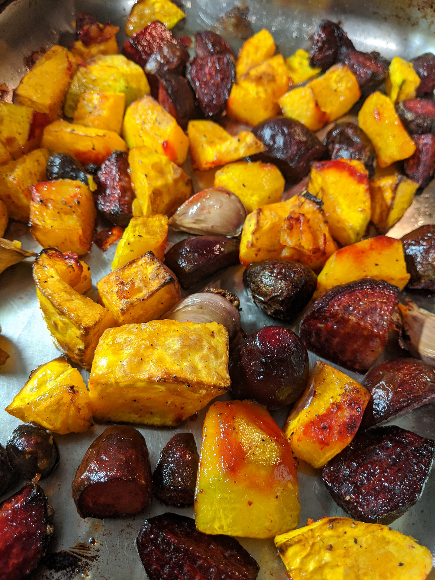 Cooked root vegetables of multiple colours