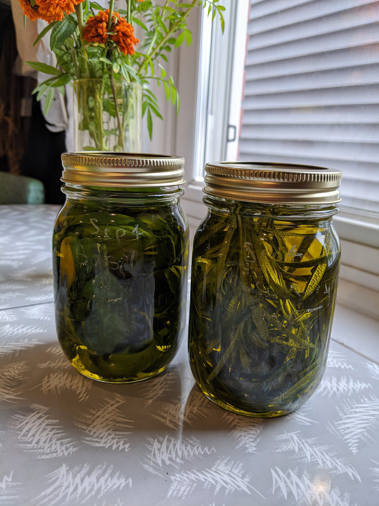 2 jars of olive oil infused with basil and rosemary
