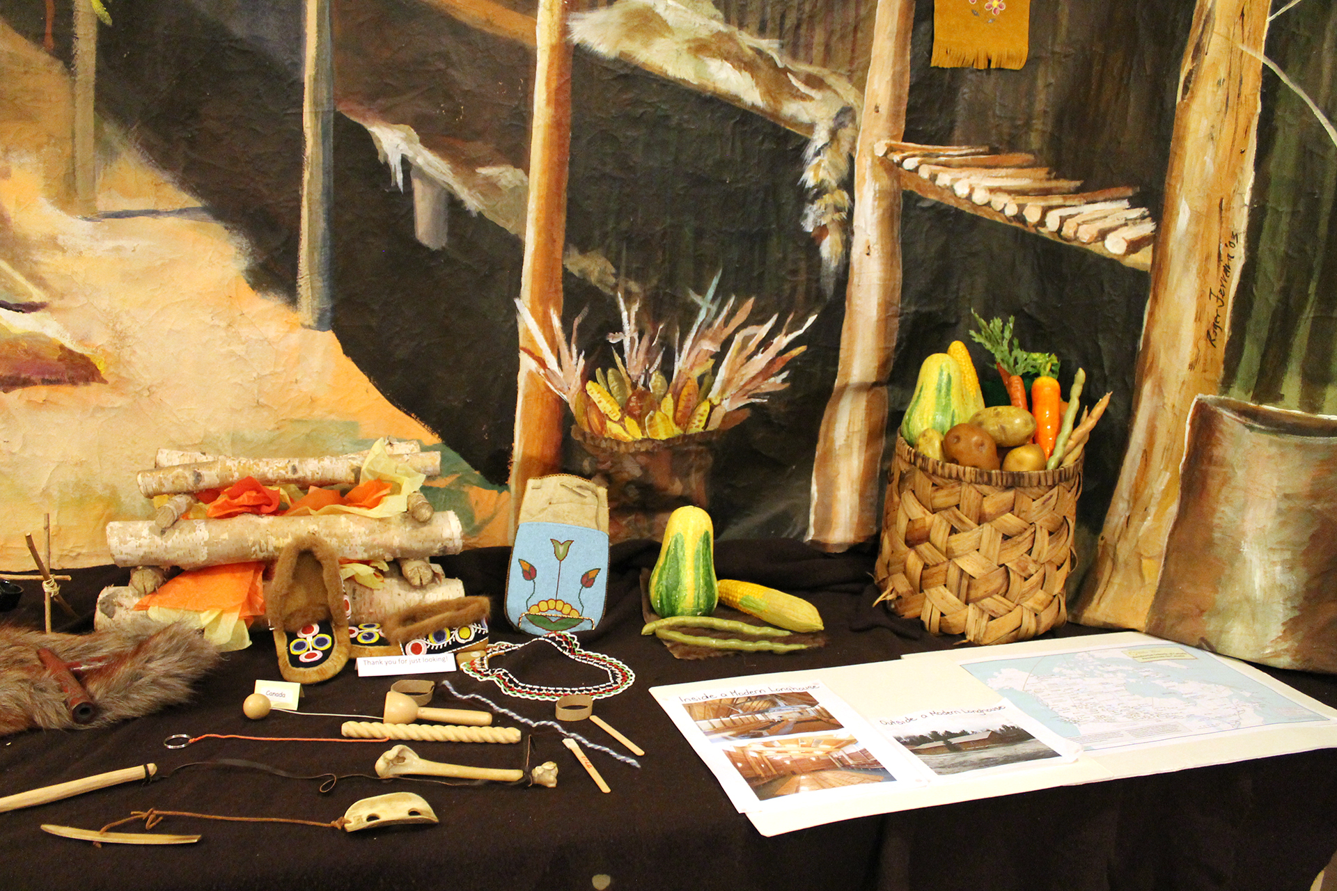 Mid Winter ceremony table setup with foods, and small wooden toys