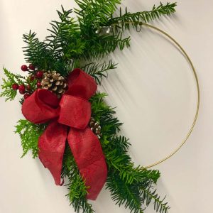 Photos-Fresh Evergreen Designs A holiday evergreen wreath with gold hoop