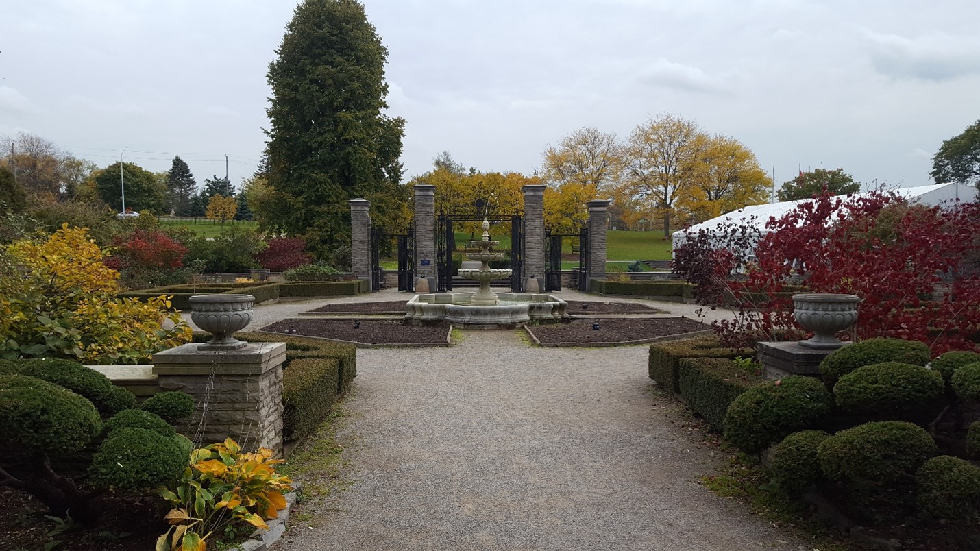Scented Garden courtyard featuring Hendrie Park Gates with old gravel pathway.