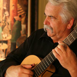 Michael Maguire playing guitar