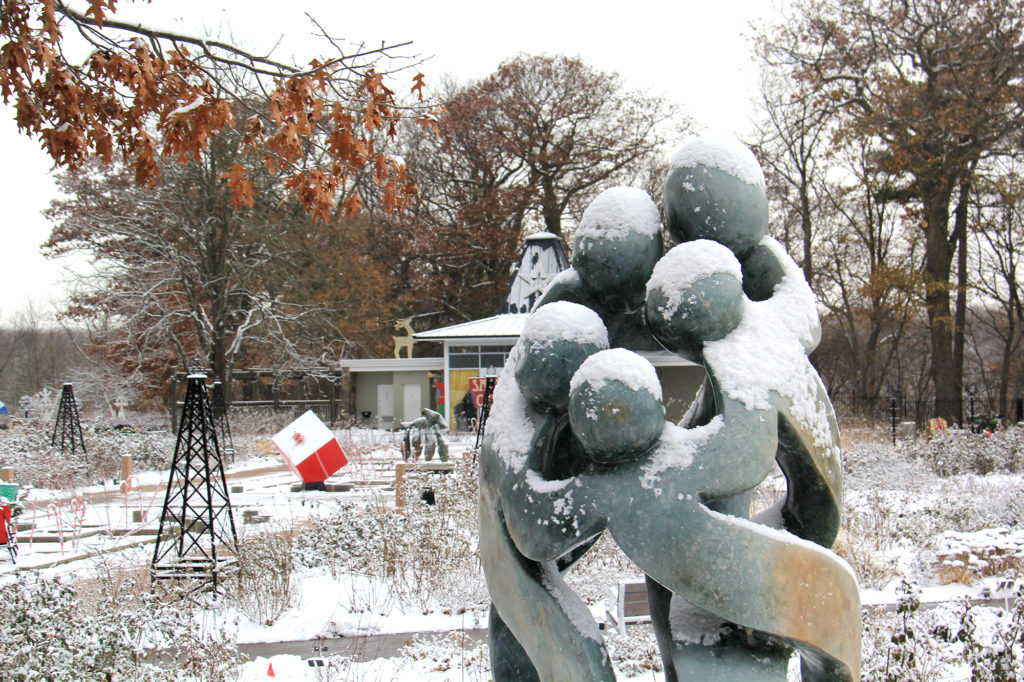 Rejoicing Family Sculpture Covered In Snow