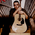Reno Silva Holding Guitar