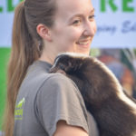 Woman holding skunk