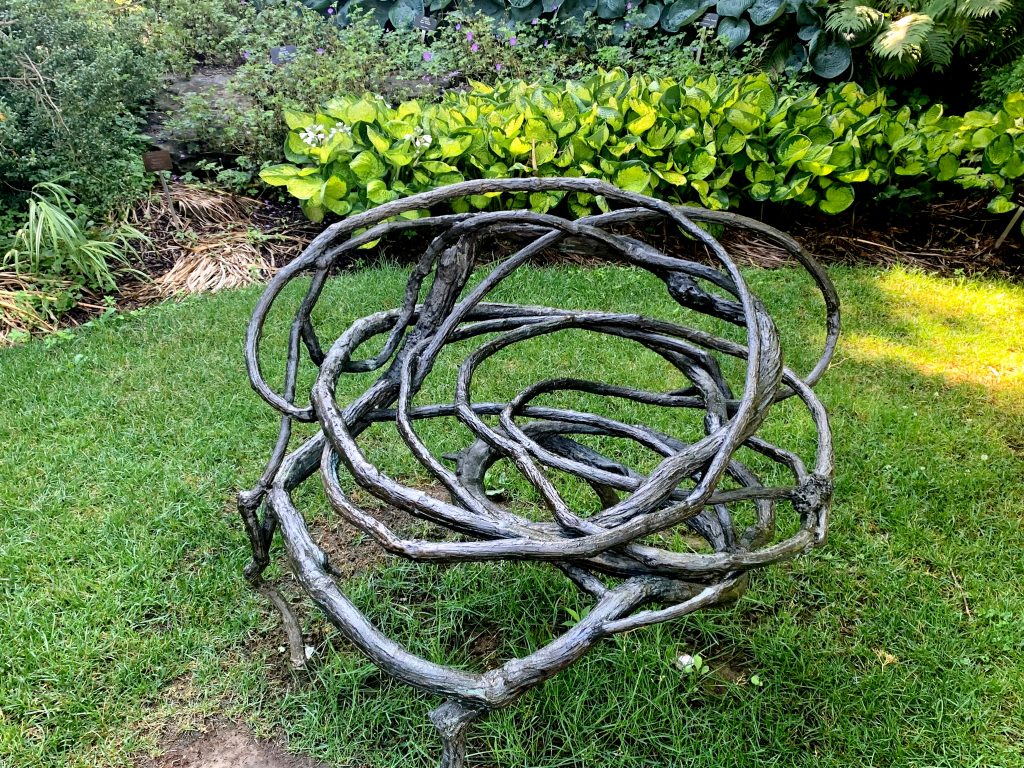 sculpture in shape of twisted vines creating stout whirlwind form
